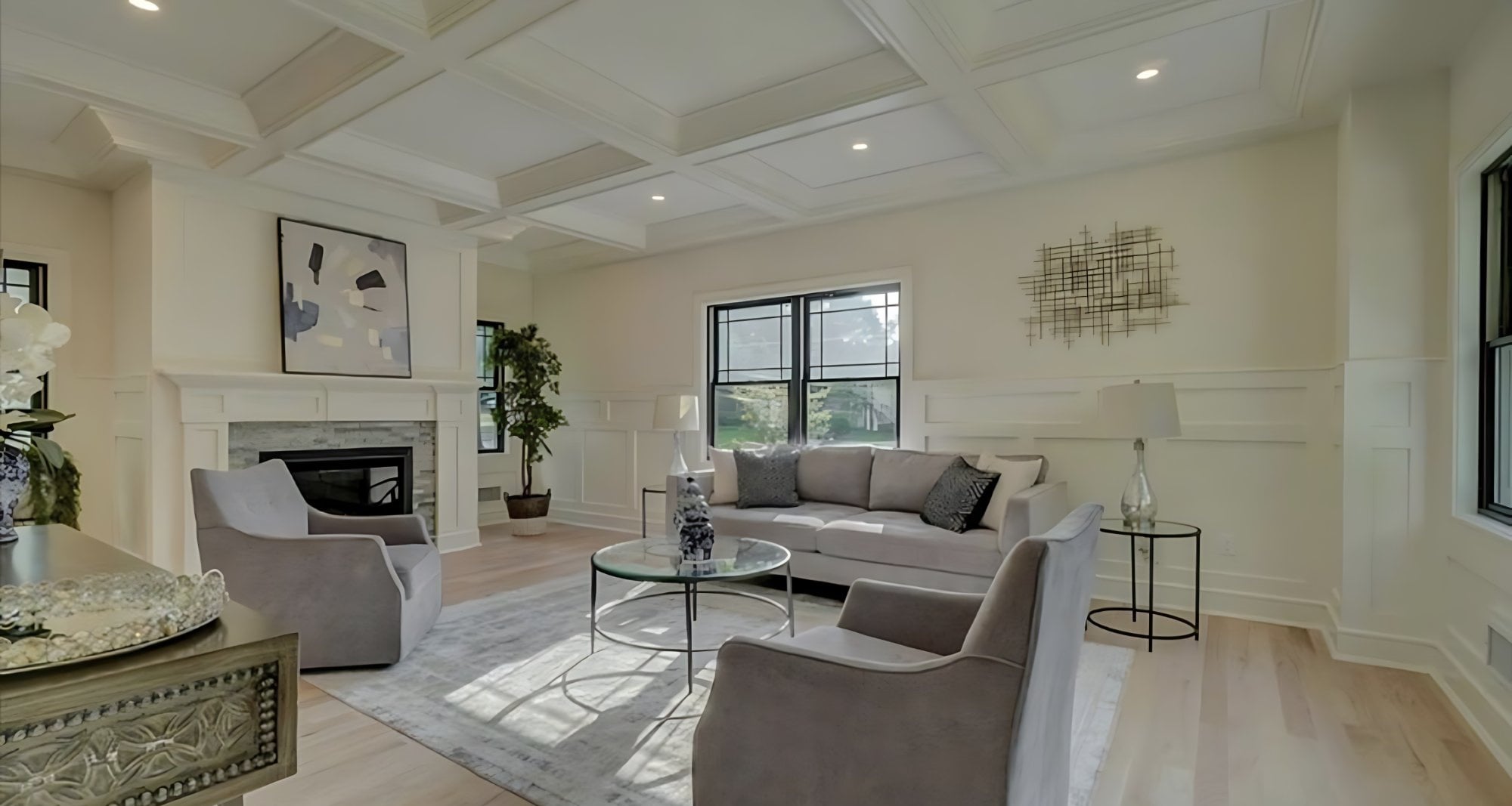 Luxury living room with coffered ceiling and fireplace
